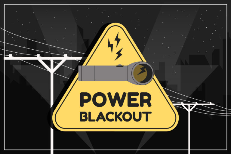 Sign power blackout and power poles in the background