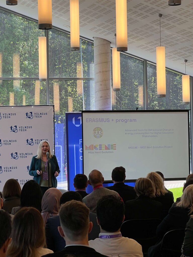 Presenter lecturing in front of audience
